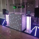 Beano Disco set up for a wedding with white and green lights