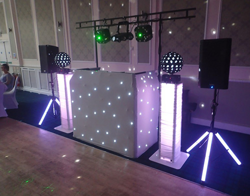 Beano Disco set up for a wedding with white and green lights