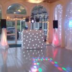 Beano Disco set up for a wedding with starlights and white backdrop